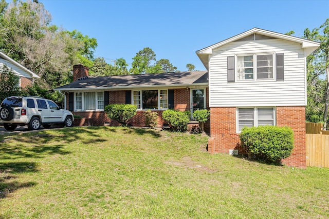 2905 Rocky Creek Rd, Augusta, GA 30906 - split level home with brick siding, a front lawn, fence, and a chimney