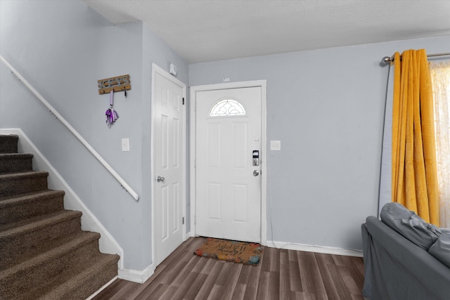 2905 Rocky Creek Rd, Augusta, GA 30906 - foyer with stairway, baseboards, and dark wood finished floors