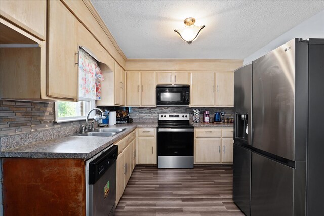 2905 Rocky Creek Rd, Augusta, GA 30906 - kitchen featuring a textured ceiling, a sink, light brown cabinets, and stainless steel appliances