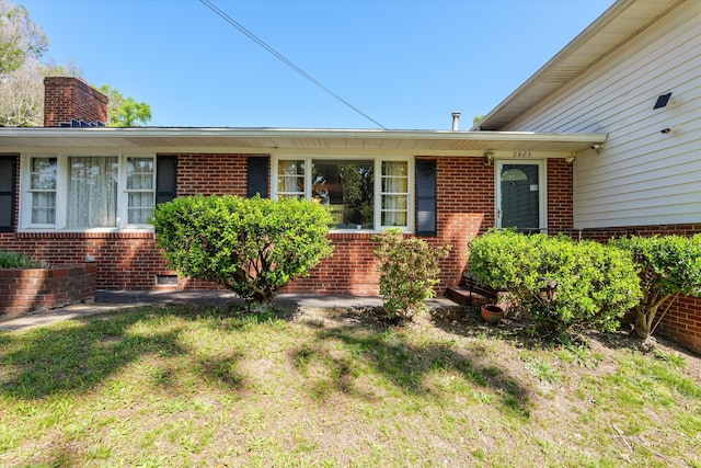 2905 Rocky Creek Rd, Augusta, GA 30906 - property entrance featuring brick siding and a chimney