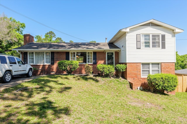 2905 Rocky Creek Rd, Augusta, GA 30906 - split level home featuring brick siding, a front lawn, fence, and a chimney