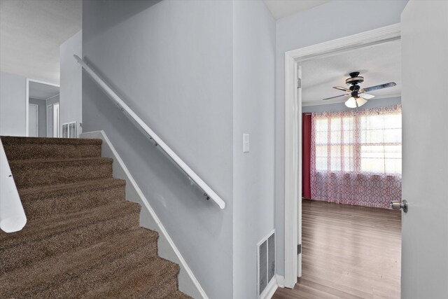 2905 Rocky Creek Rd, Augusta, GA 30906 - stairs featuring visible vents, ceiling fan, and wood finished floors