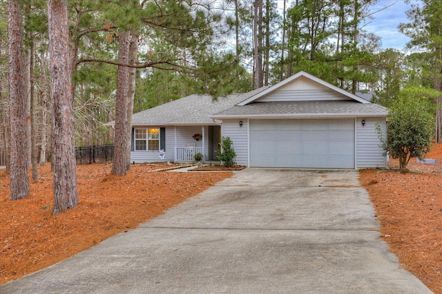 ranch-style home with a porch and a garage