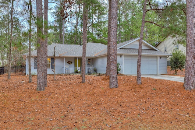 ranch-style home with a porch and a garage