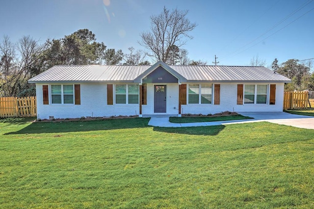 ranch-style house with metal roof, brick siding, a front yard, and fence