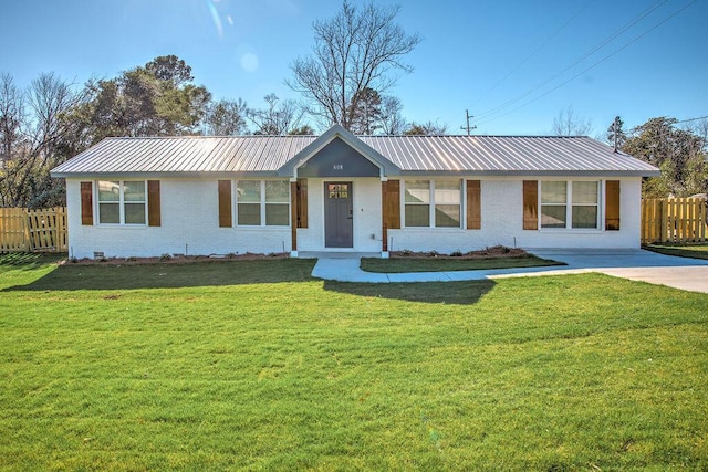 single story home featuring metal roof, crawl space, fence, a front lawn, and brick siding