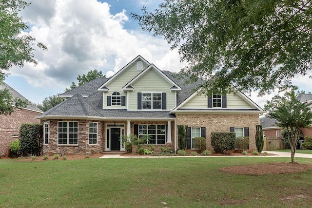 5191 Windmill Pl, Evans, GA 30809 - view of front facade with a front yard, brick siding, and a shingled roof