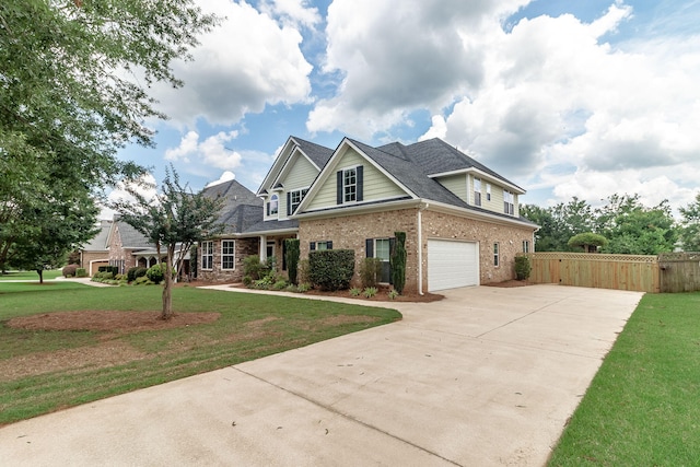 5191 Windmill Pl, Evans, GA 30809 - view of front facade featuring driveway, brick siding, a garage, a shingled roof, and a gate