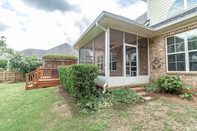 5191 Windmill Pl, Evans, GA 30809 - view of side of property featuring a sunroom, brick siding, a deck, and a shingled roof