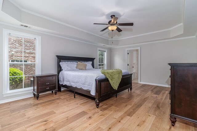 5191 Windmill Pl, Evans, GA 30809 - bedroom featuring a raised ceiling, light wood-type flooring, ornamental molding, and ceiling fan