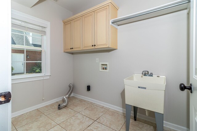 5191 Windmill Pl, Evans, GA 30809 - laundry area featuring washer hookup, cabinet space, and light tile patterned flooring