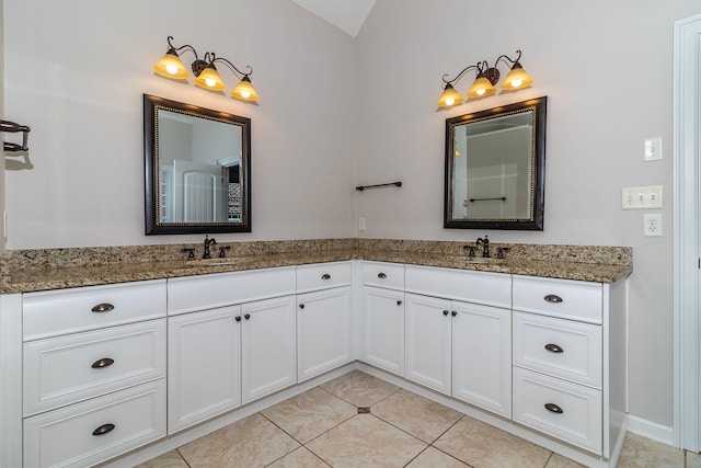 5191 Windmill Pl, Evans, GA 30809 - bathroom featuring double vanity, tile patterned floors, and vaulted ceiling