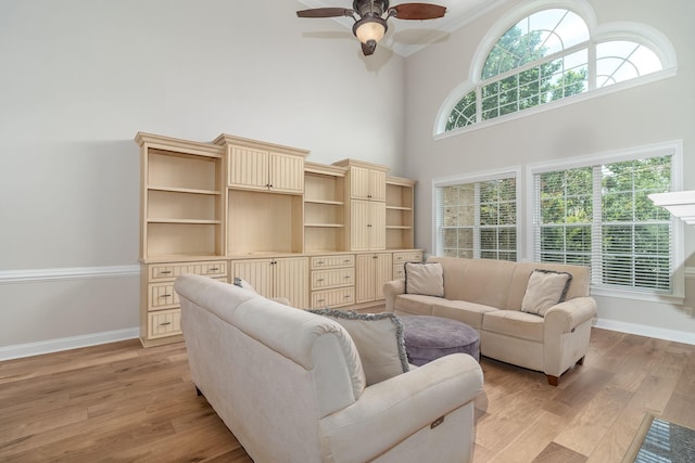 5191 Windmill Pl, Evans, GA 30809 - living room with a towering ceiling, light wood finished floors, and ceiling fan