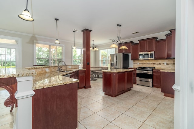 5191 Windmill Pl, Evans, GA 30809 - kitchen featuring stainless steel appliances, ornamental molding, a spacious island, tasteful backsplash, and healthy amount of natural light