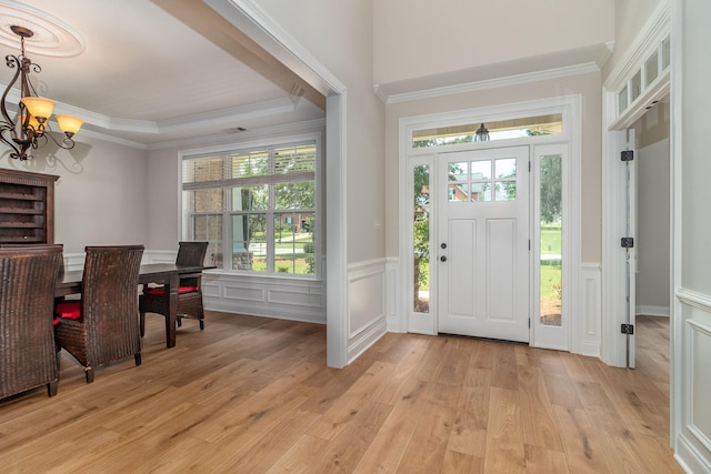 5191 Windmill Pl, Evans, GA 30809 - entrance foyer with a chandelier, plenty of natural light, light wood-style floors, a decorative wall, and crown molding