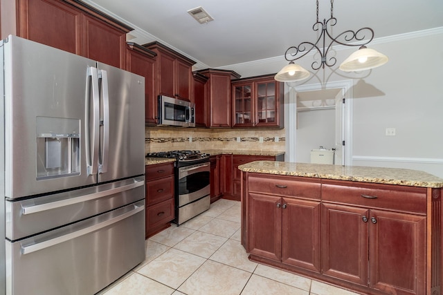 5191 Windmill Pl, Evans, GA 30809 - kitchen with stainless steel appliances, crown molding, tasteful backsplash, light tile patterned flooring, and reddish brown cabinets