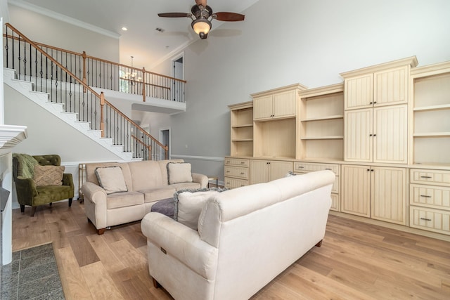5191 Windmill Pl, Evans, GA 30809 - living room featuring light wood-style floors, stairs, crown molding, ceiling fan, and recessed lighting