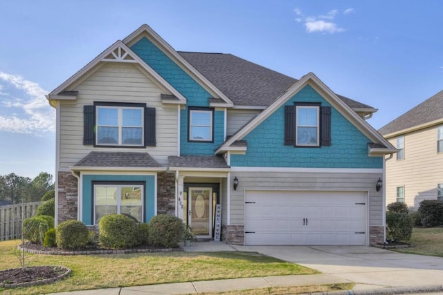 craftsman-style home with a garage and a front lawn