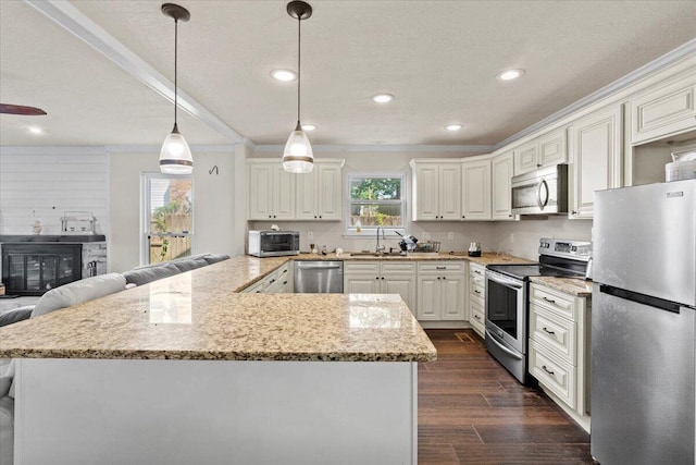 227 Waters Way, Martinez, GA 30907 - kitchen with stainless steel appliances, a sink, ornamental molding, light stone countertops, and dark wood-type flooring