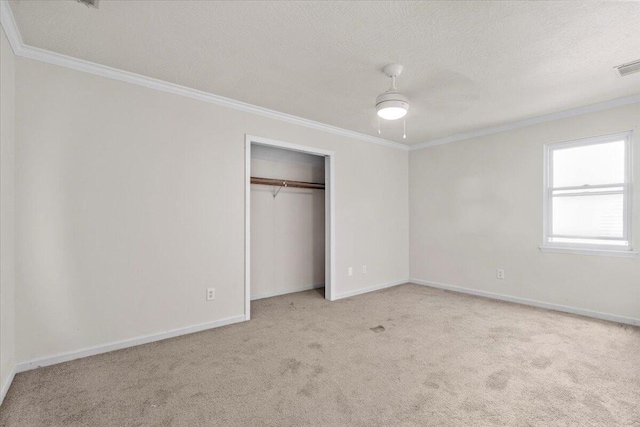 227 Waters Way, Martinez, GA 30907 - unfurnished bedroom featuring ornamental molding, carpet, baseboards, a closet, and a textured ceiling