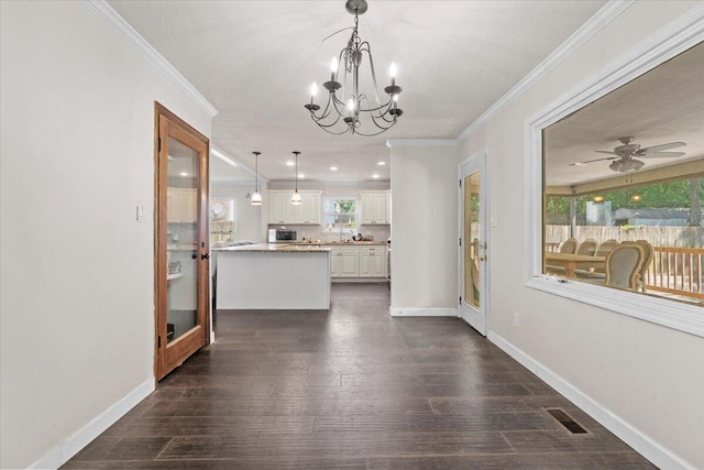 227 Waters Way, Martinez, GA 30907 - unfurnished dining area with crown molding, a chandelier, dark wood finished floors, a ceiling fan, and baseboards