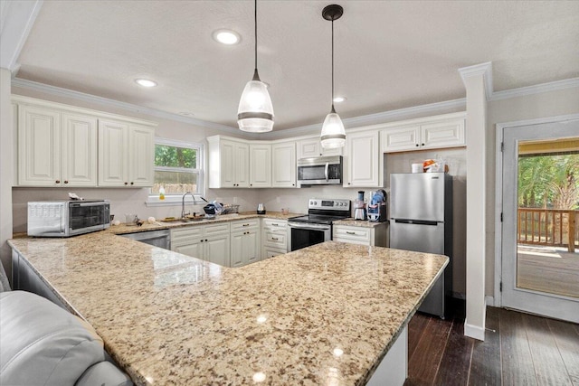 227 Waters Way, Martinez, GA 30907 - kitchen featuring stainless steel appliances, a sink, light stone countertops, a peninsula, and ornamental molding