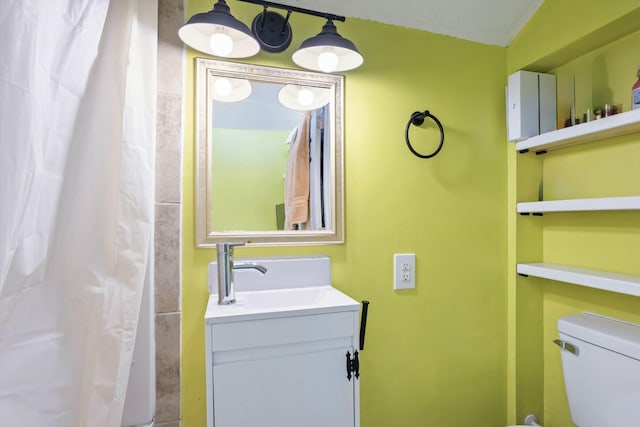 full bath featuring toilet and vanity