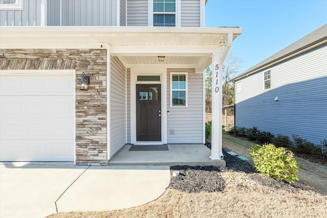 property entrance with a garage