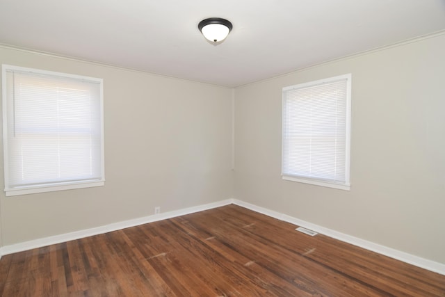 unfurnished room featuring dark hardwood / wood-style flooring