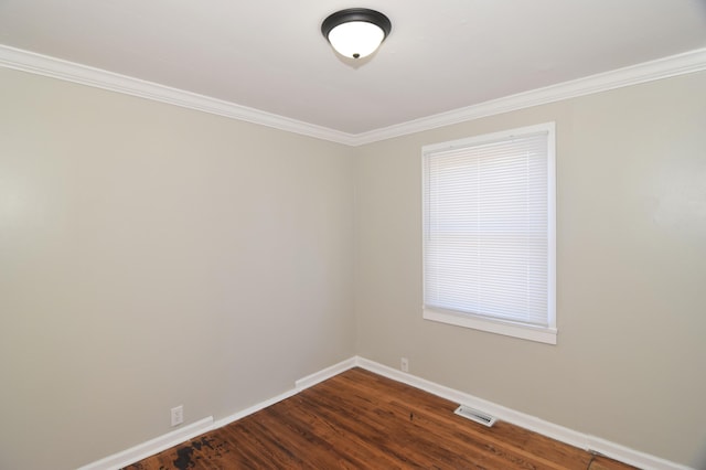 unfurnished room featuring dark hardwood / wood-style flooring and ornamental molding