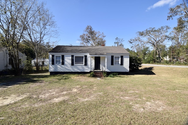 view of front of property with a front lawn