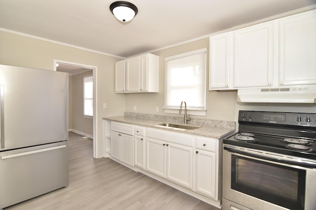 kitchen with white cabinetry, sink, light hardwood / wood-style floors, appliances with stainless steel finishes, and ornamental molding