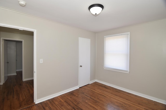 spare room featuring dark hardwood / wood-style floors