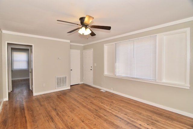 unfurnished room featuring ceiling fan, hardwood / wood-style flooring, and ornamental molding