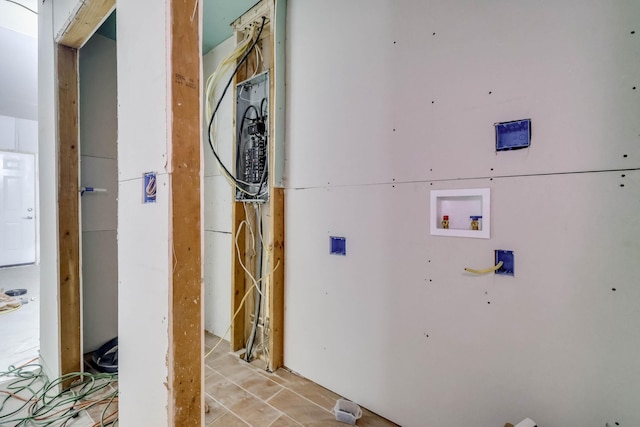 washroom with electric panel and hookup for a washing machine