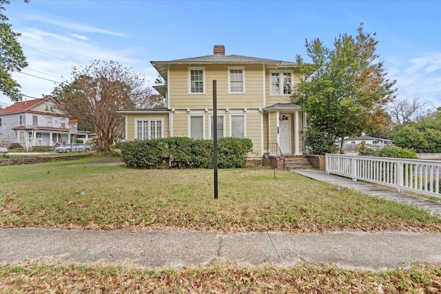 view of front of property with a front lawn