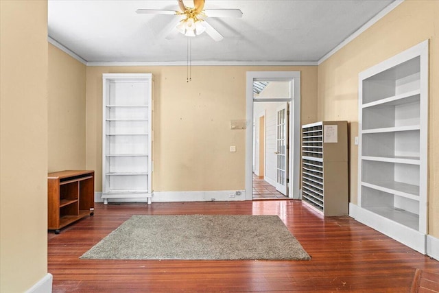 spare room featuring ceiling fan, dark hardwood / wood-style flooring, and ornamental molding