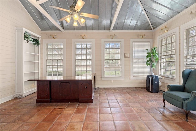 sunroom / solarium featuring vaulted ceiling with beams and ceiling fan