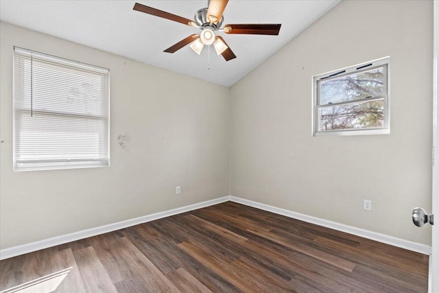 unfurnished room featuring a ceiling fan, baseboards, vaulted ceiling, and dark wood finished floors