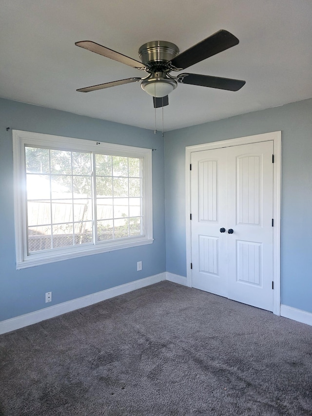 4596 Hickory Dr, Evans, GA 30809 - unfurnished bedroom featuring multiple windows, baseboards, and carpet