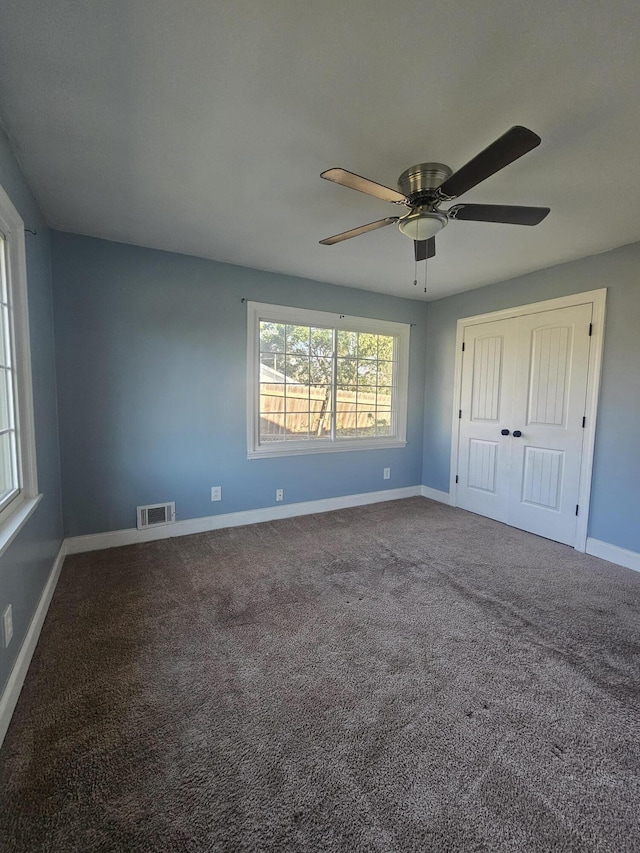 4596 Hickory Dr, Evans, GA 30809 - unfurnished bedroom with visible vents, baseboards, a ceiling fan, and carpet flooring