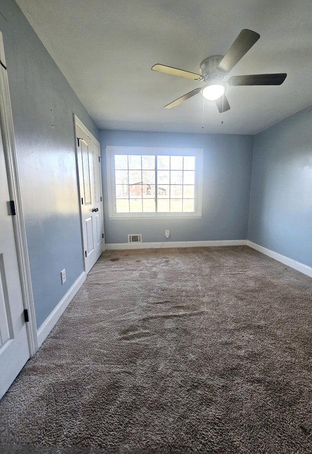 4596 Hickory Dr, Evans, GA 30809 - unfurnished room featuring visible vents, baseboards, carpet, and a ceiling fan