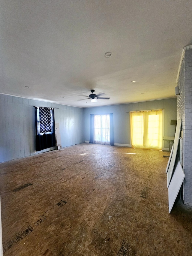 4596 Hickory Dr, Evans, GA 30809 - spare room with a fireplace and a ceiling fan