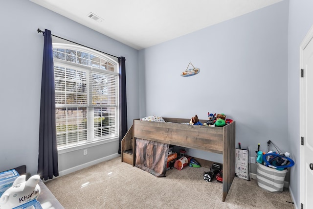 bedroom with light carpet