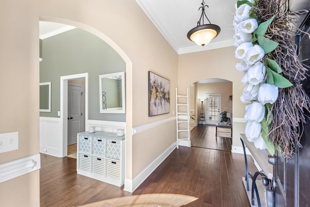 entryway with crown molding and dark hardwood / wood-style flooring