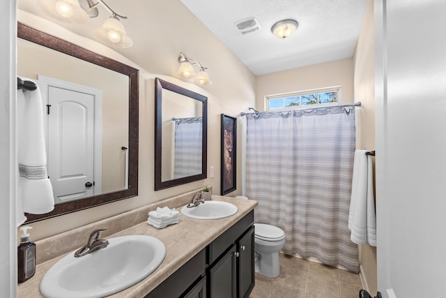 bathroom with vanity, walk in shower, and toilet