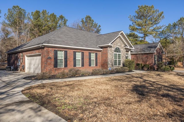 view of front of house with a garage and a front yard