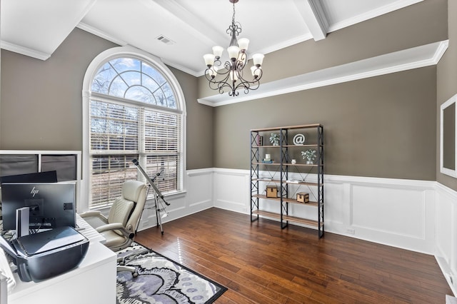 home office featuring dark wood-type flooring, ornamental molding, and beamed ceiling