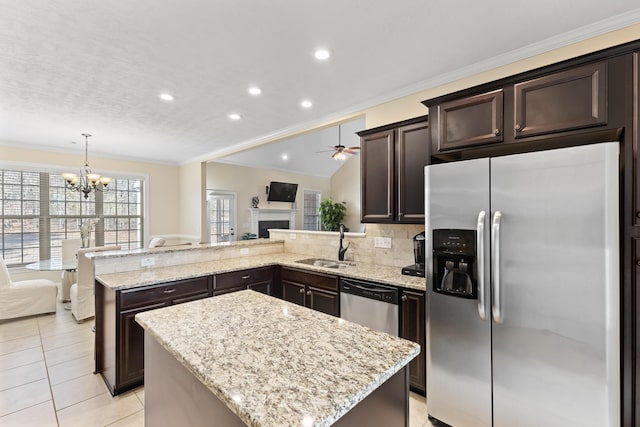 kitchen with hanging light fixtures, a center island, appliances with stainless steel finishes, and sink