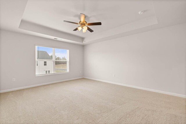 3447 Firestone Dr, Hephzibah, GA 30815 - empty room with baseboards, a tray ceiling, carpet floors, and ceiling fan